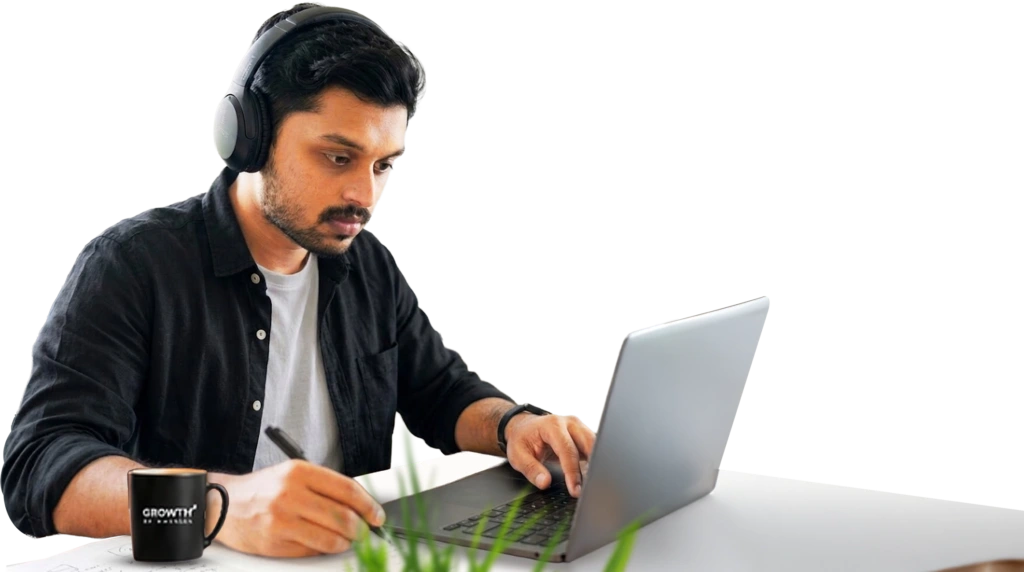 Mohammed Basheer working on a laptop
